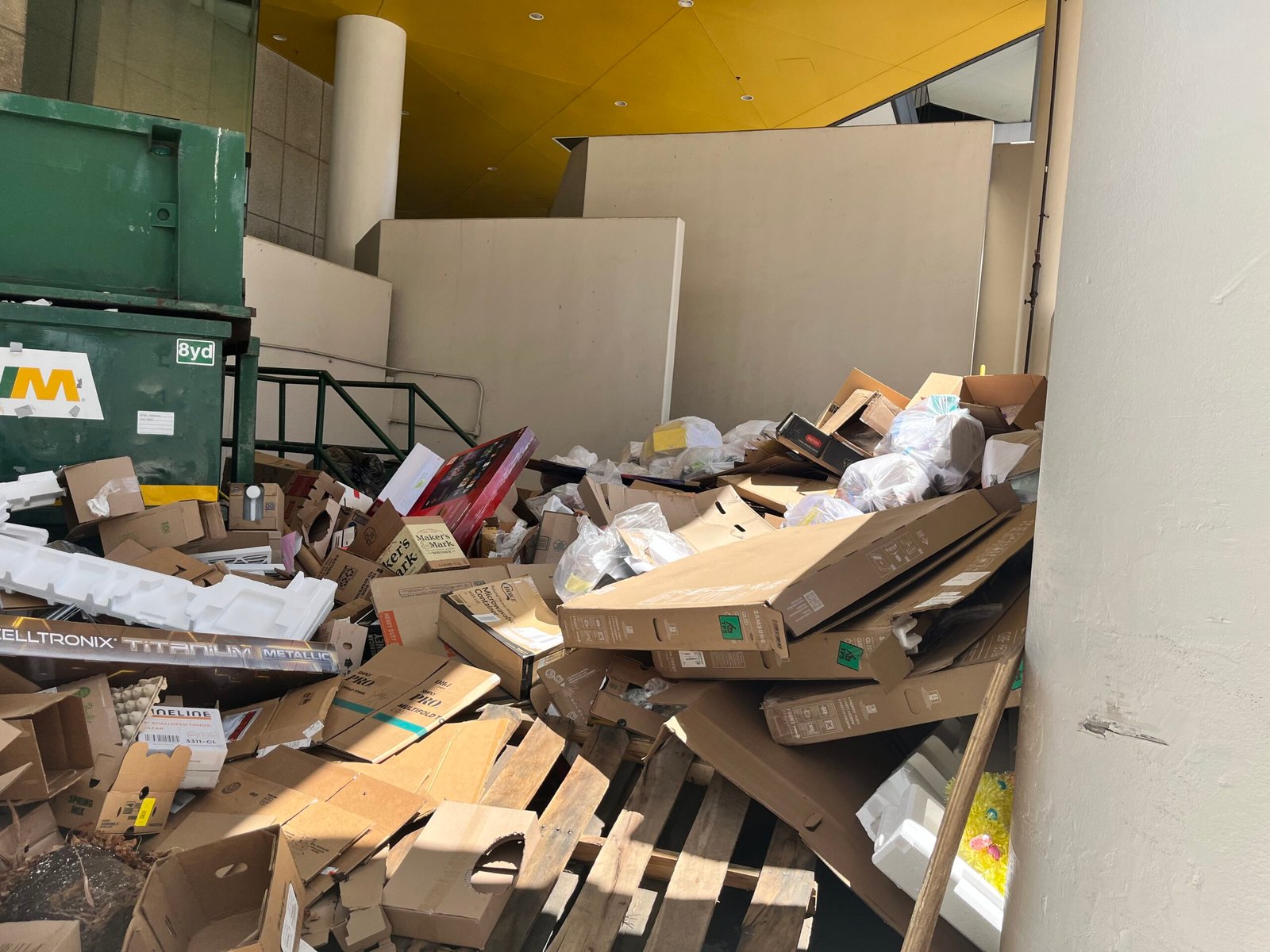 Overflowing dumpster before pickup